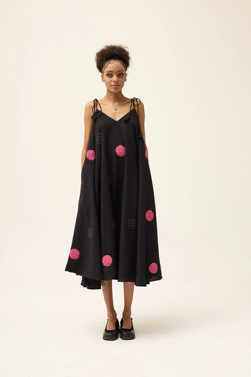 White Canvas Pink Whirl Polka Dress in pink handwoven dobby cotton with applique work and Kantha stitching, front view on model