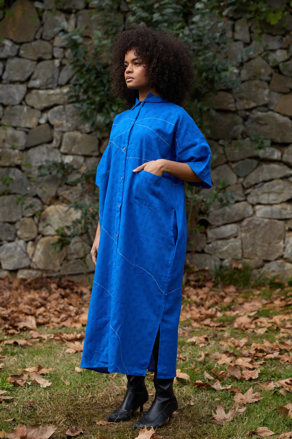 White Canvas Cloud Shine Dress in blue handwoven dobby cotton with Kantha stitching, angled view on model