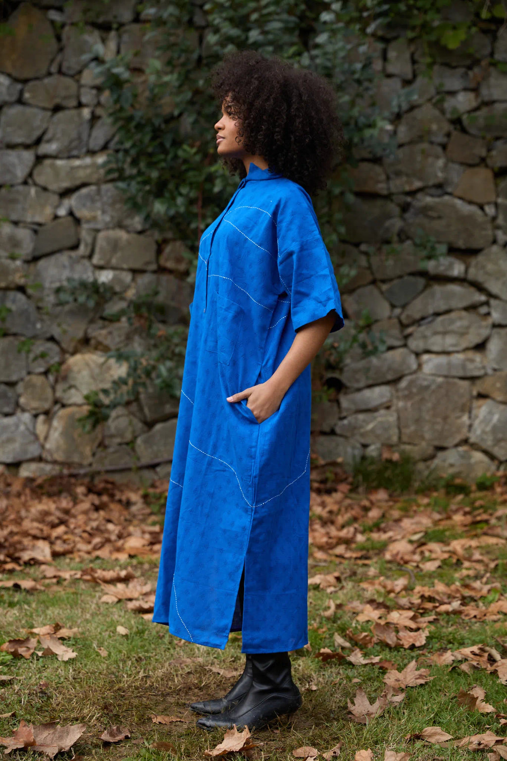 White Canvas Cloud Shine Dress in blue handwoven dobby cotton with Kantha stitching, side view on model