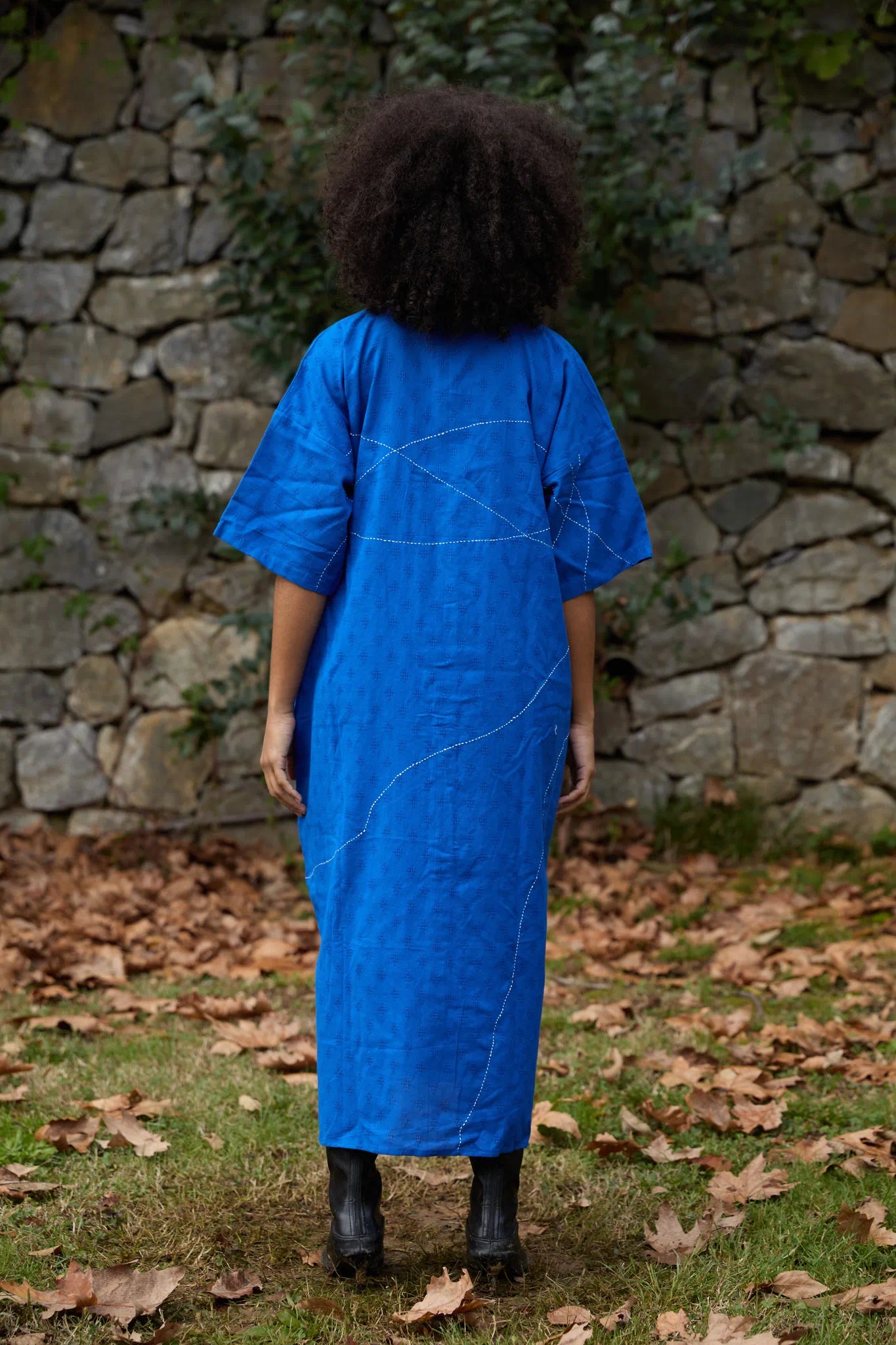 White Canvas Cloud Shine Dress in blue handwoven dobby cotton with Kantha stitching, back view on model