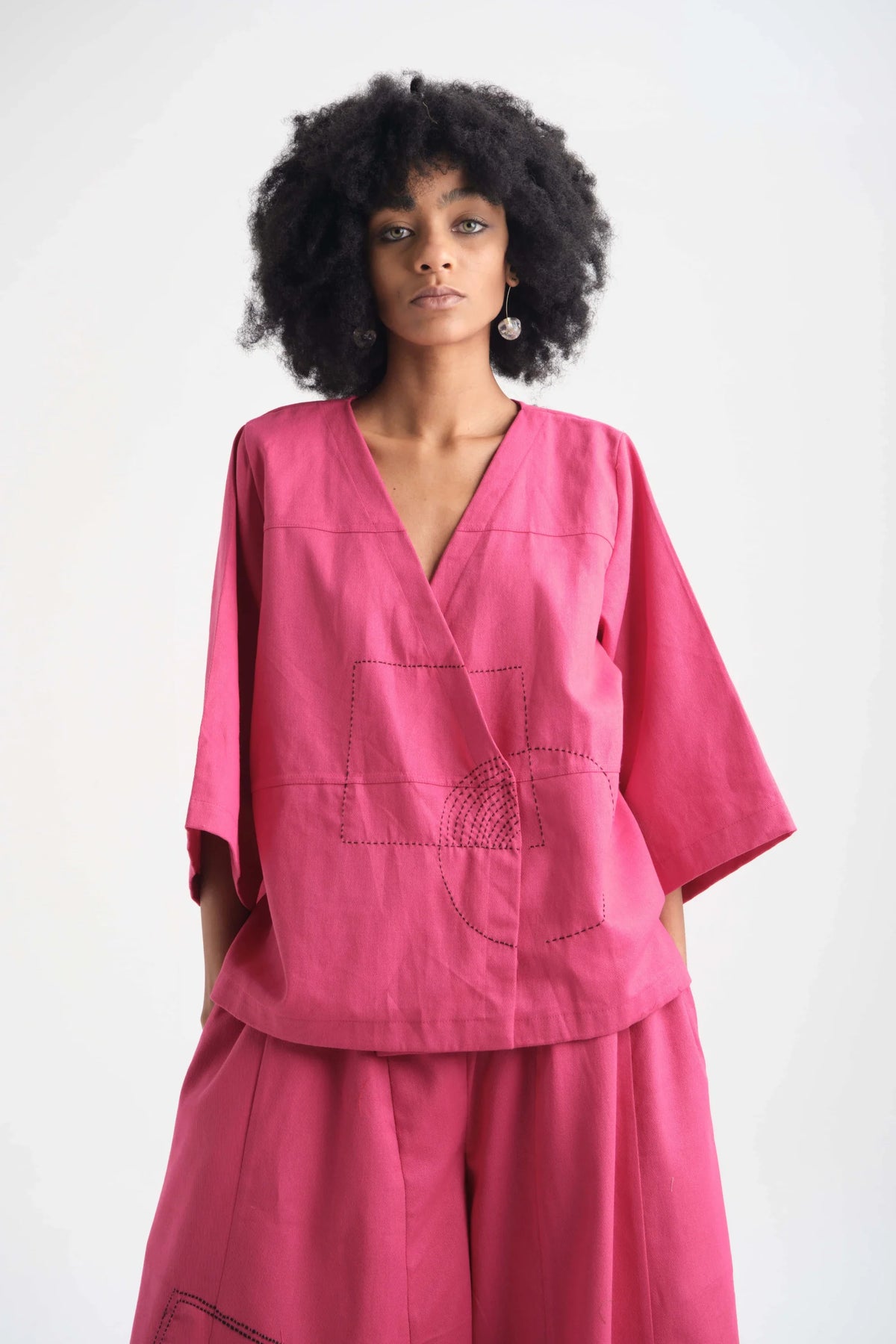 White Canvas Pink Peony Top in pink organic drill cotton with embroidery, front view on model