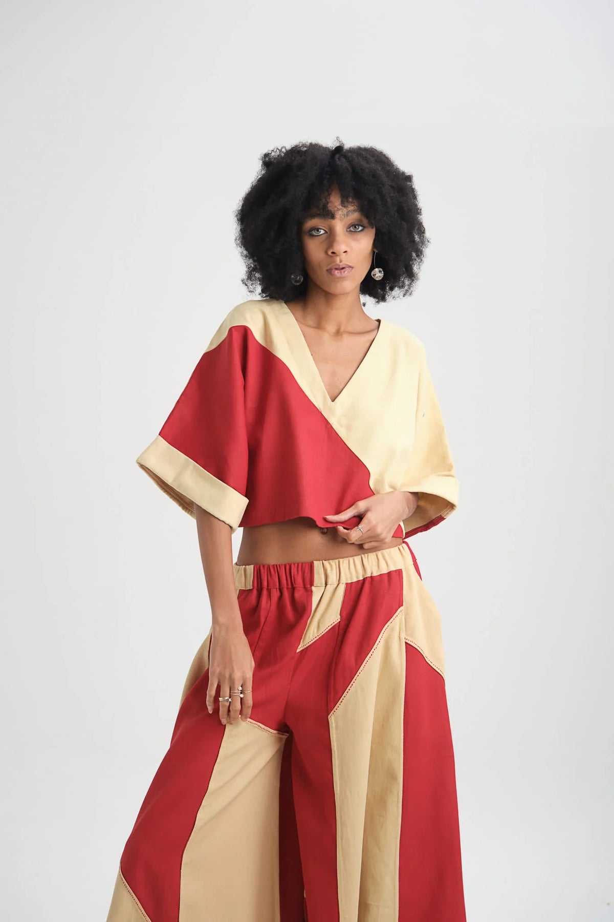 White Canvas Red Tulip Set in red organic drill cotton with embroidery, angled view on model