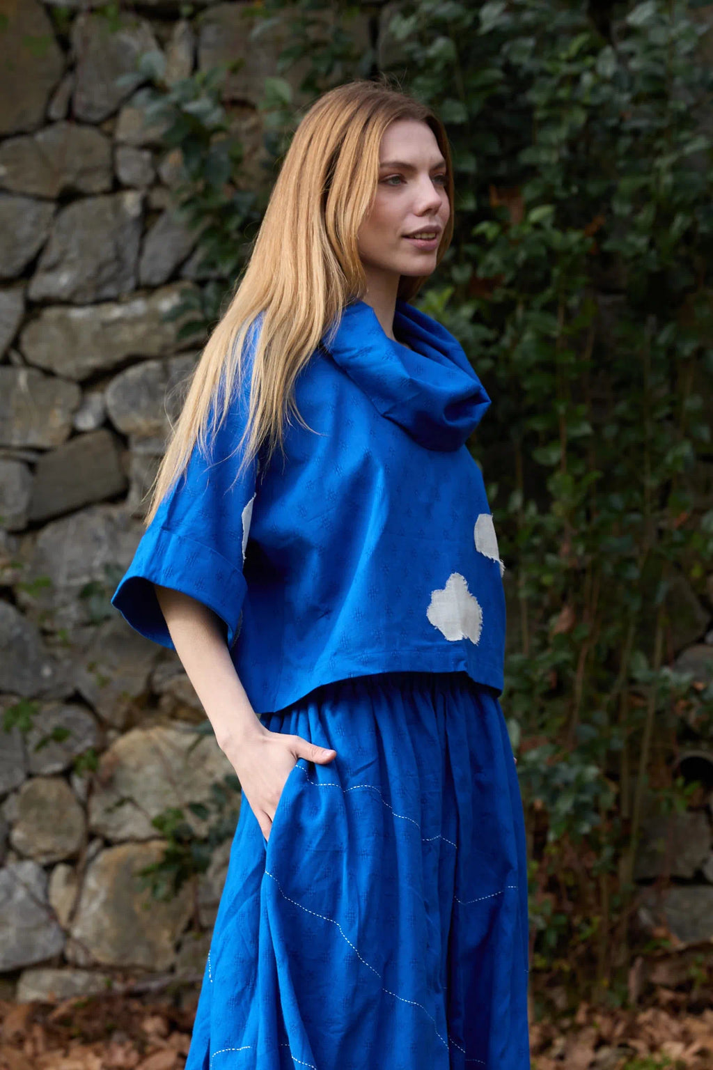 White Canvas Cloud Butter Top in blue handwoven dobby cotton with applique work, side view on model