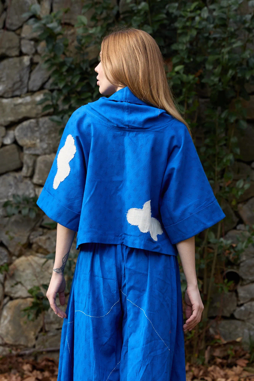 White Canvas Cloud Butter Top in blue handwoven dobby cotton with applique work, back view on model