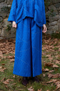 White Canvas Cloud Dahlia Pants in blue handwoven dobby cotton with Kantha stitching, front view on model