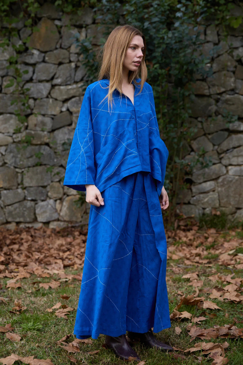White Canvas Cloud Dahlia Set in blue handwoven dobby cotton with Kantha stitching, angled view on model