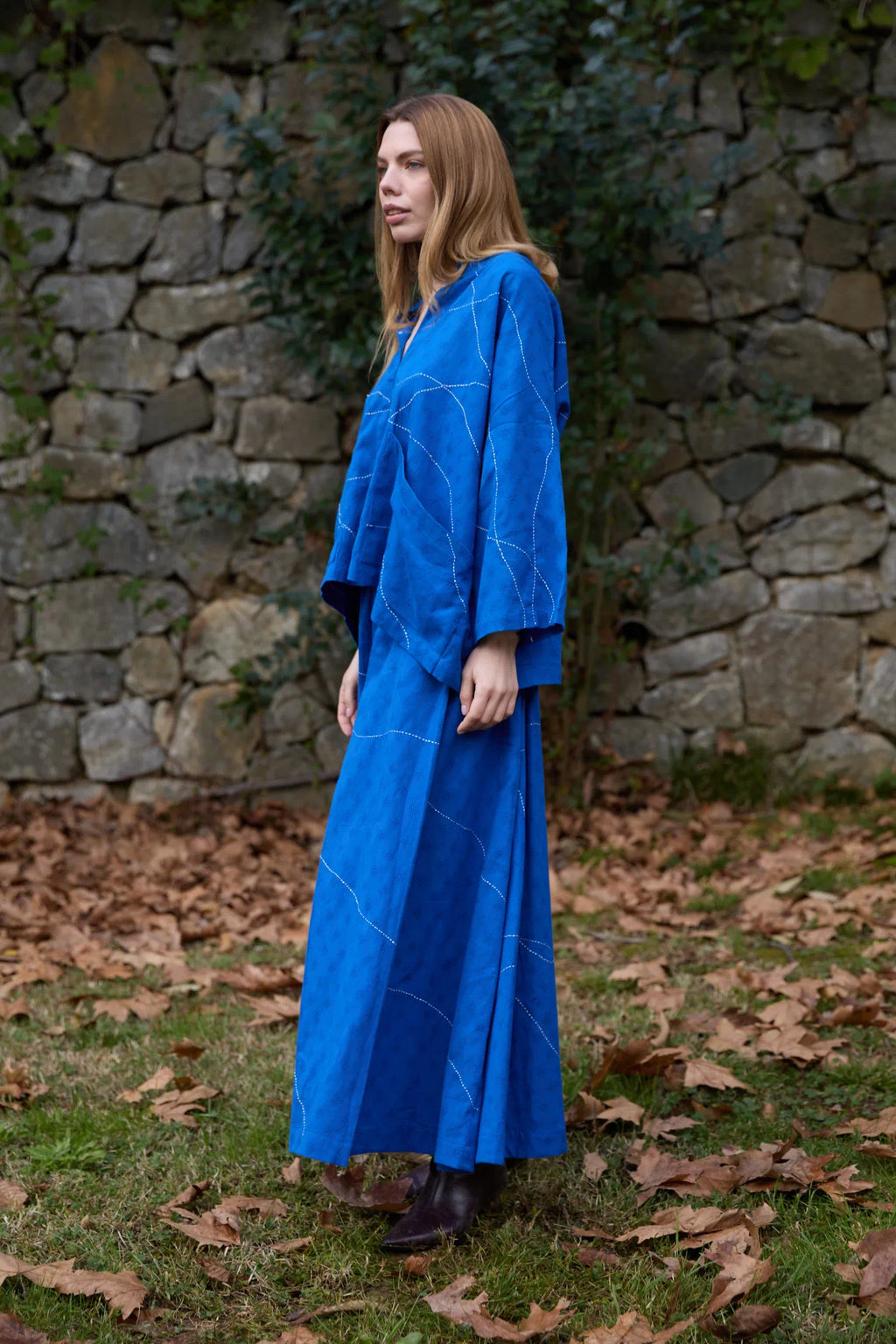 White Canvas Cloud Dahlia Set in blue handwoven dobby cotton with Kantha stitching, side view on model