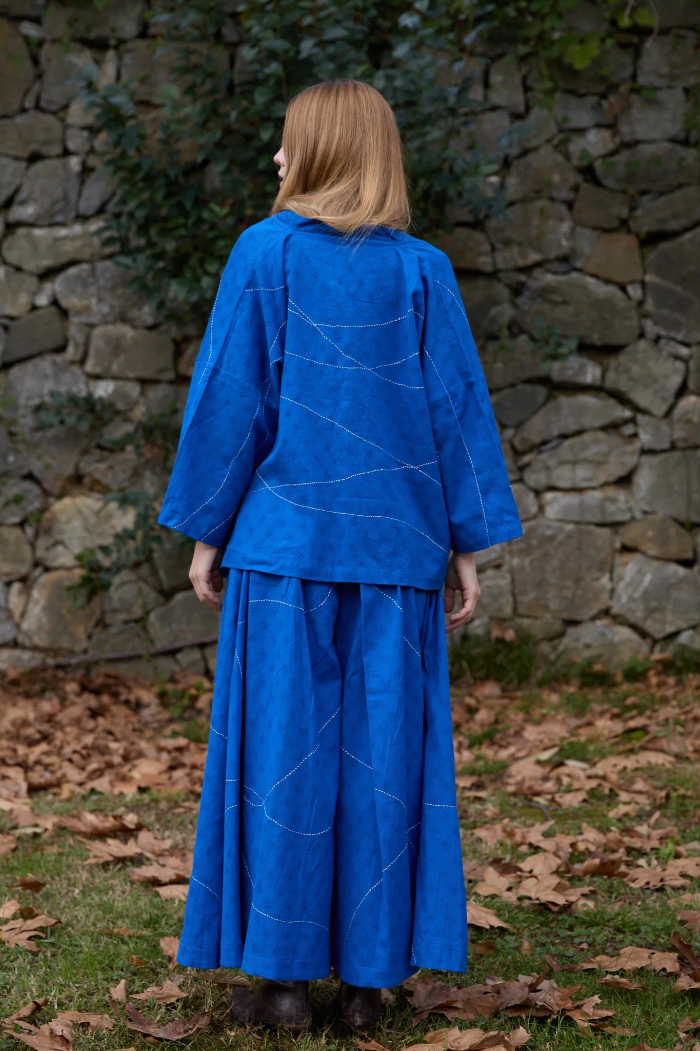 White Canvas Cloud Dahlia Set in blue handwoven dobby cotton with Kantha stitching, back view on model