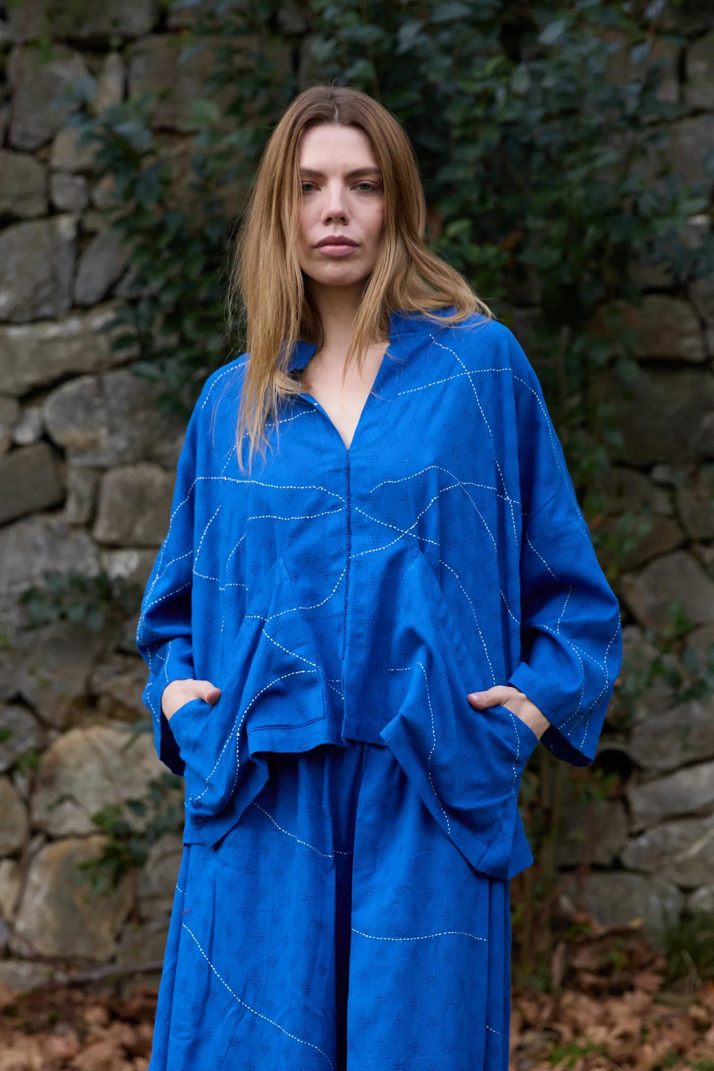 White Canvas Cloud Dahlia Top in blue handwoven dobby cotton with Kantha stitching, detail view on model