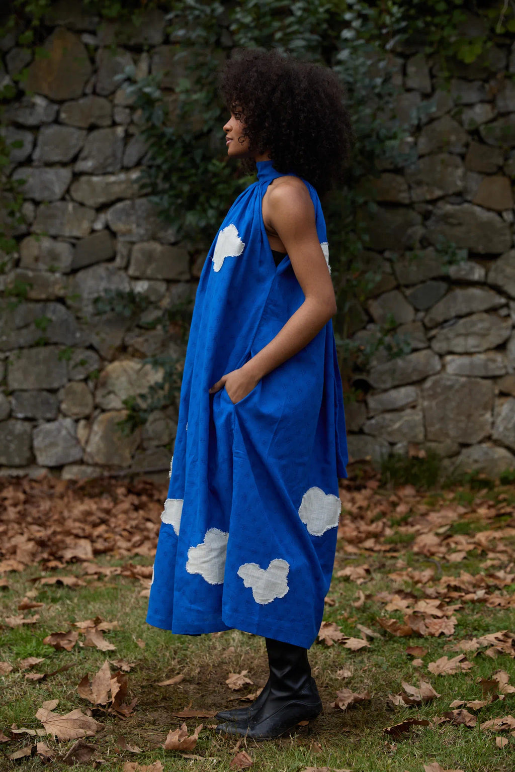 White Canvas Cloud Flintstone Dress in blue handwoven dobby cotton with applique work, angled view on model