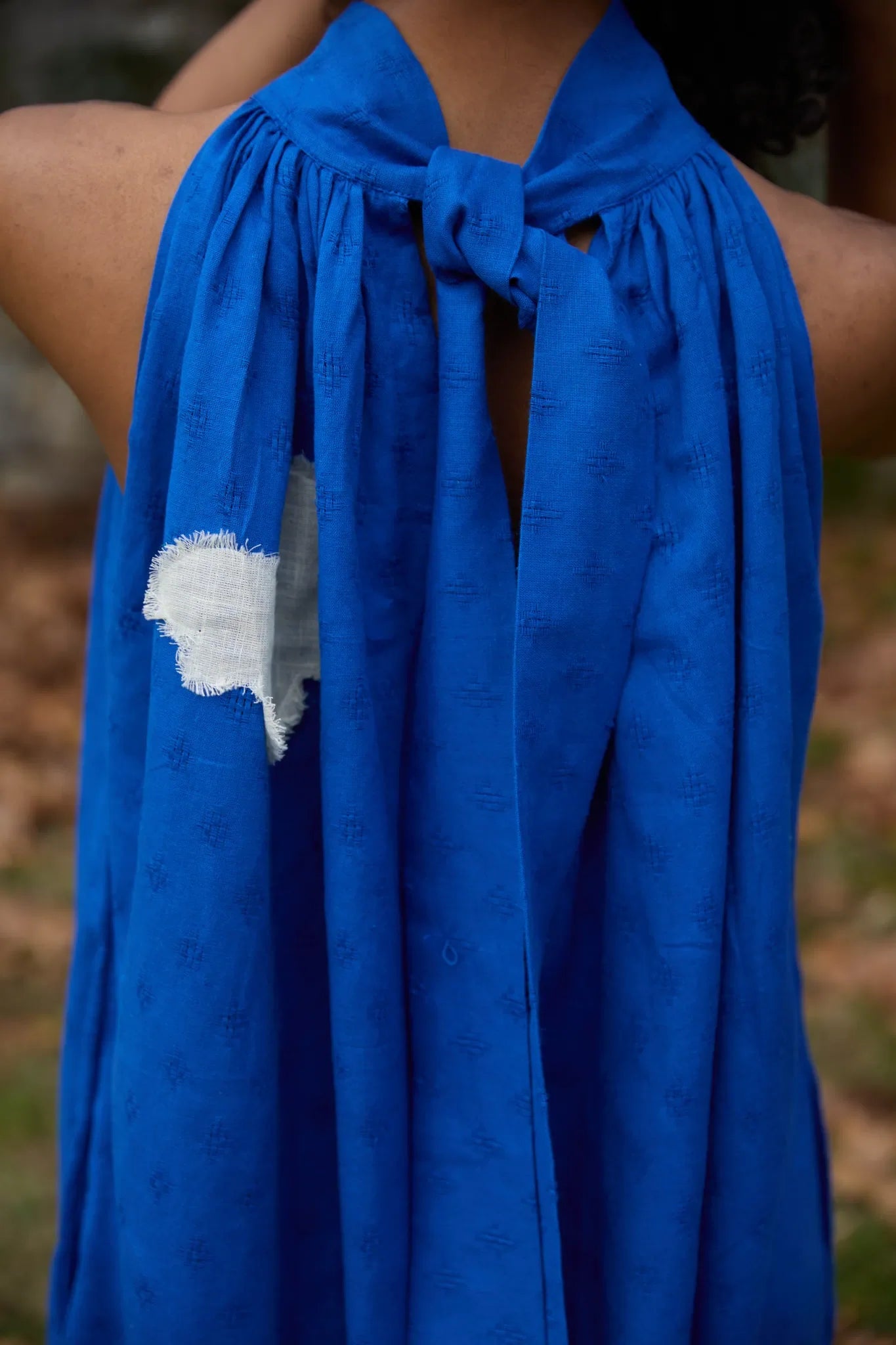 White Canvas Cloud Flintstone Dress in blue handwoven dobby cotton with applique work, full-length styled view