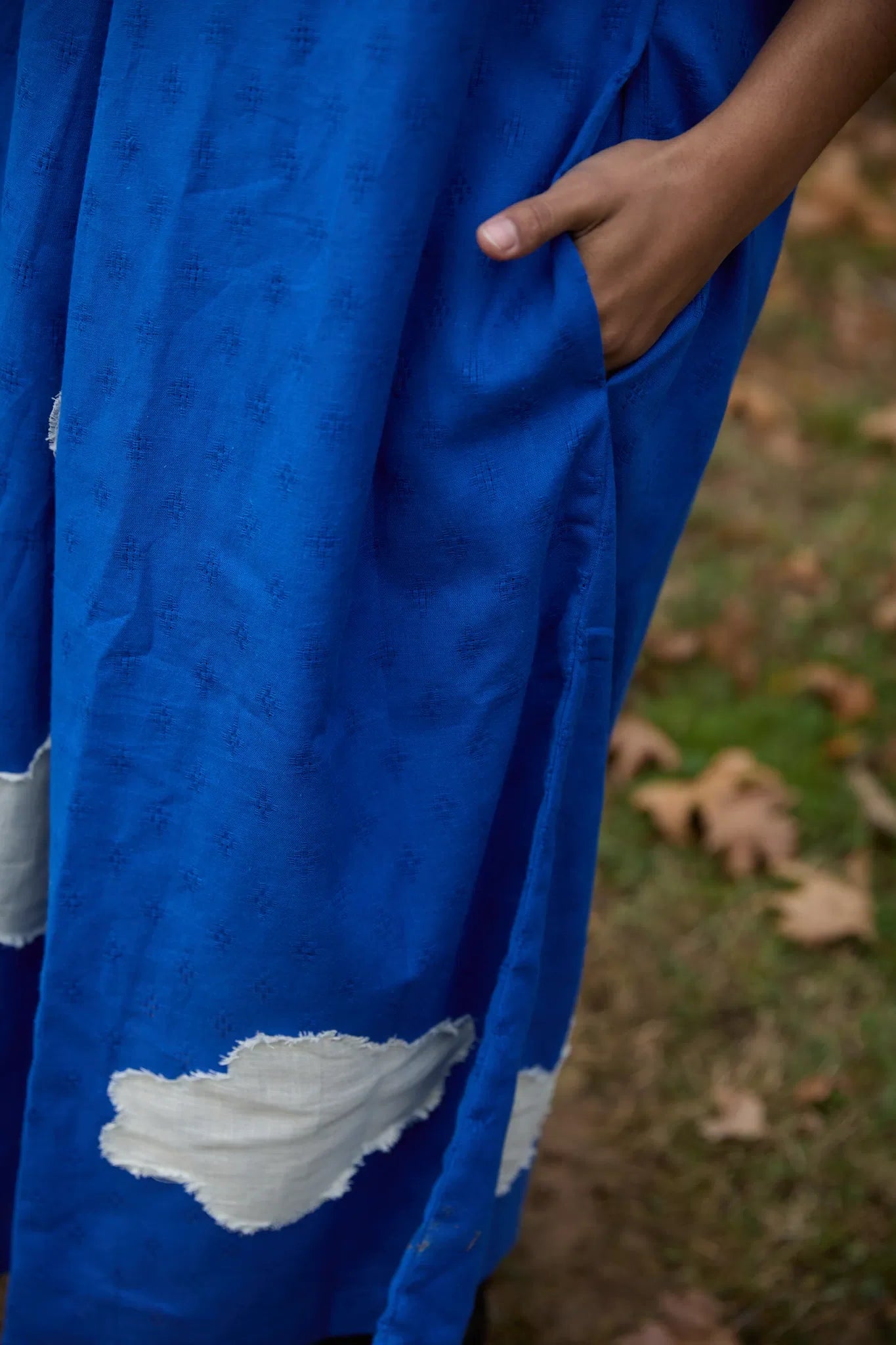 White Canvas Cloud Flintstone Dress in blue handwoven dobby cotton with applique work, alternate styled view
