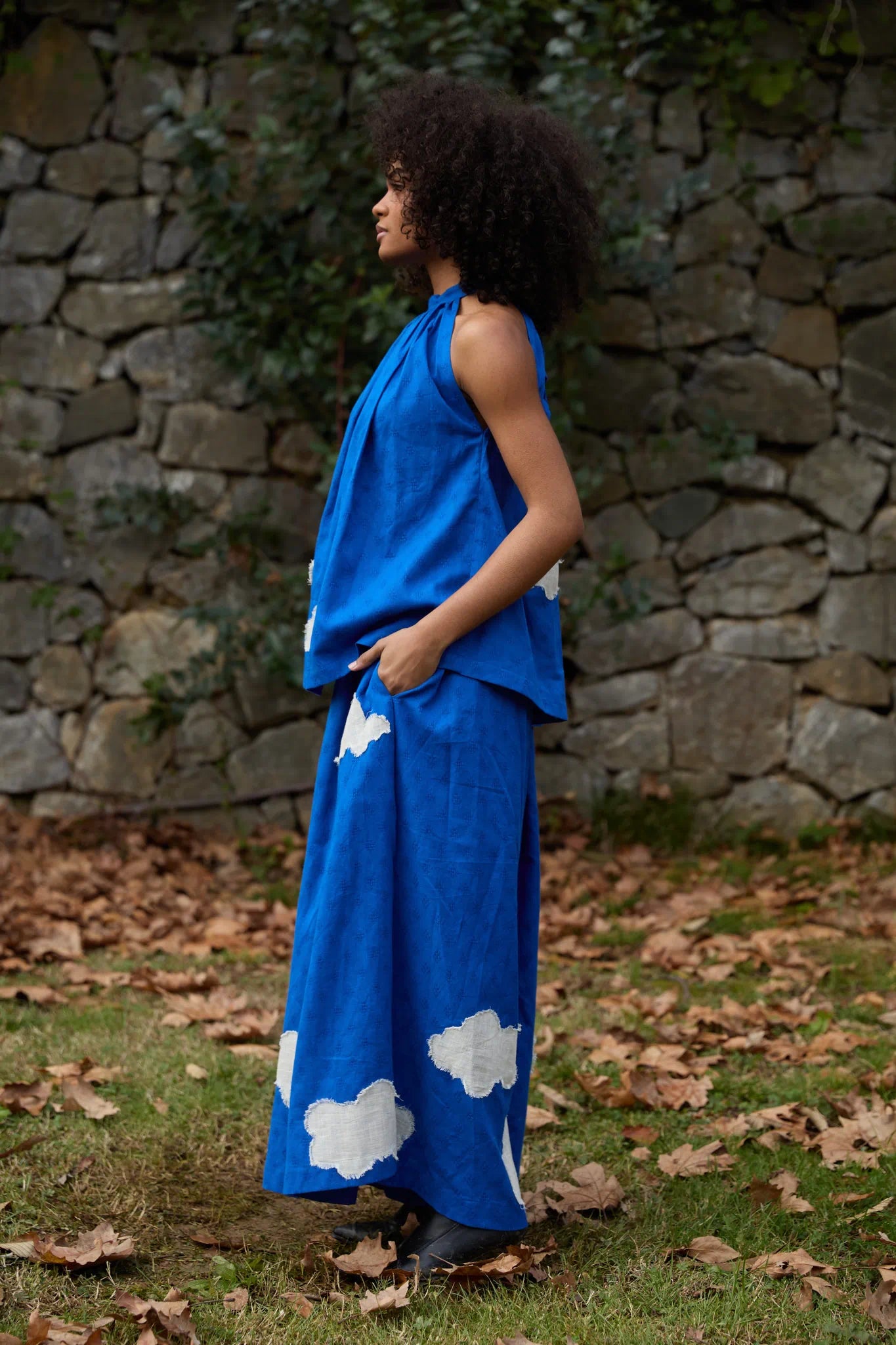 White Canvas Cloud Flintstone Set in blue handwoven dobby cotton with applique work, side view on model