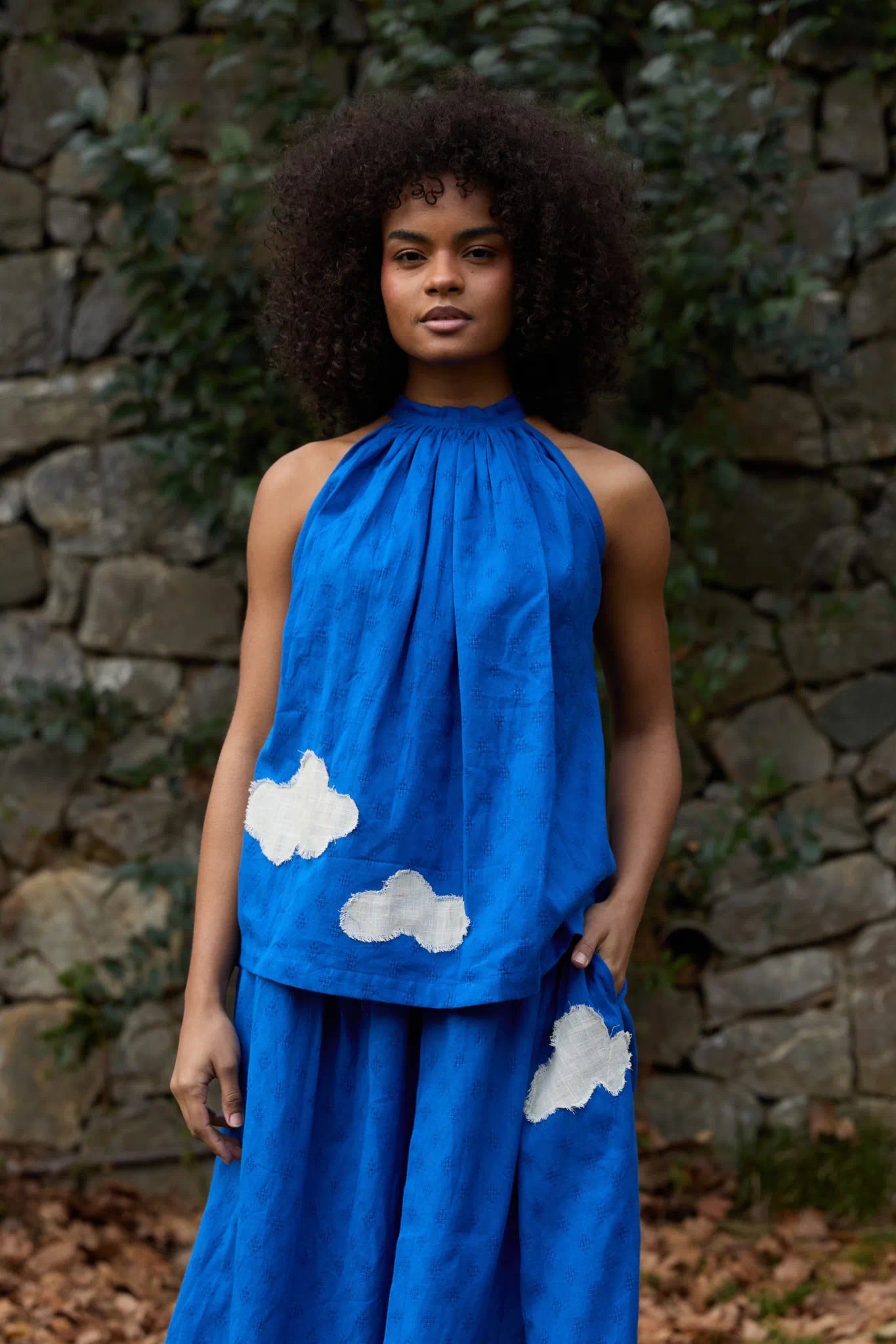 White Canvas Cloud Flintstone Top in blue handwoven dobby cotton with applique work, front view on model