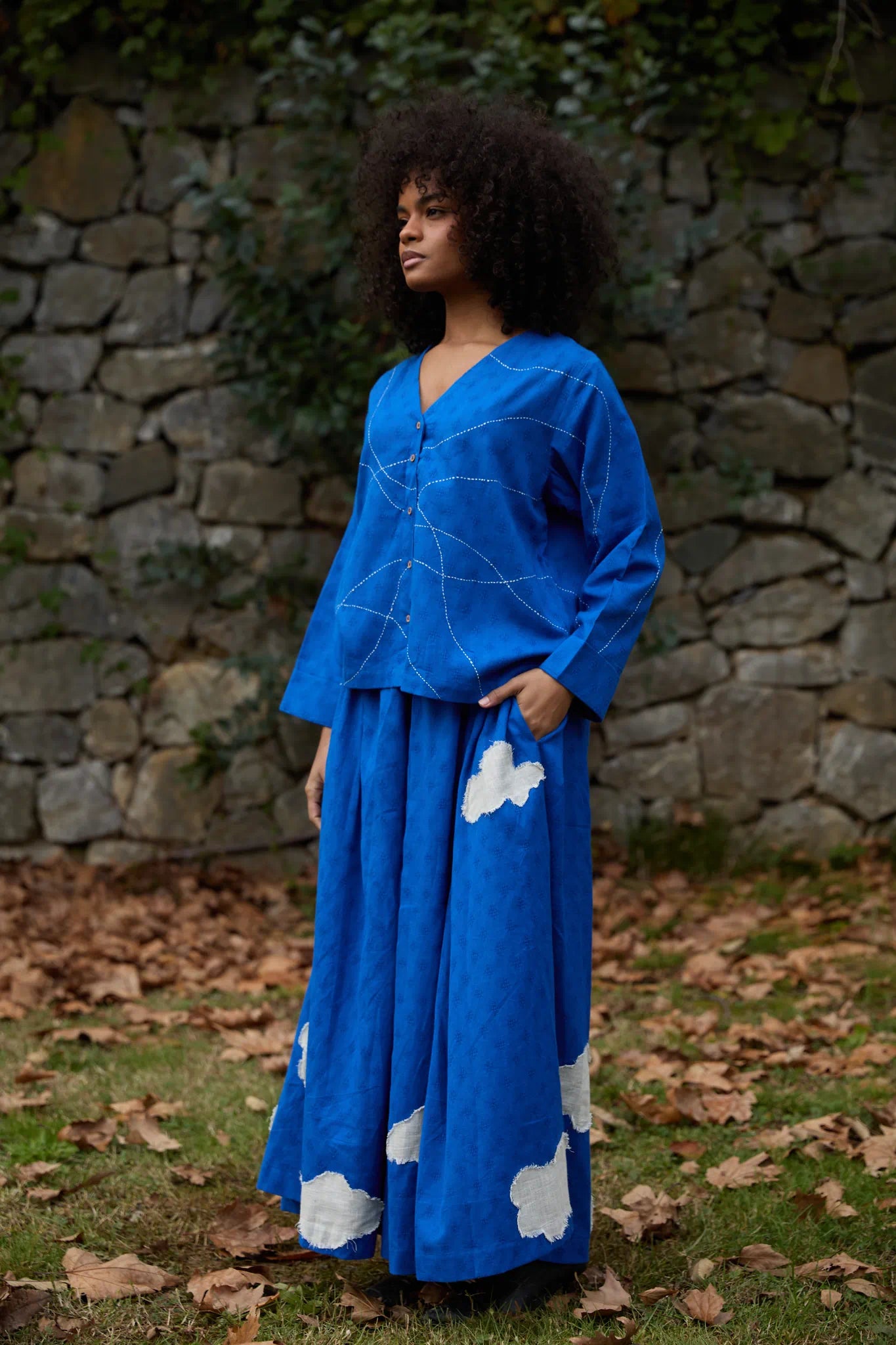 White Canvas Cloud Glimpse Set in blue handwoven dobby cotton with applique work and Kantha stitching, angled view on model