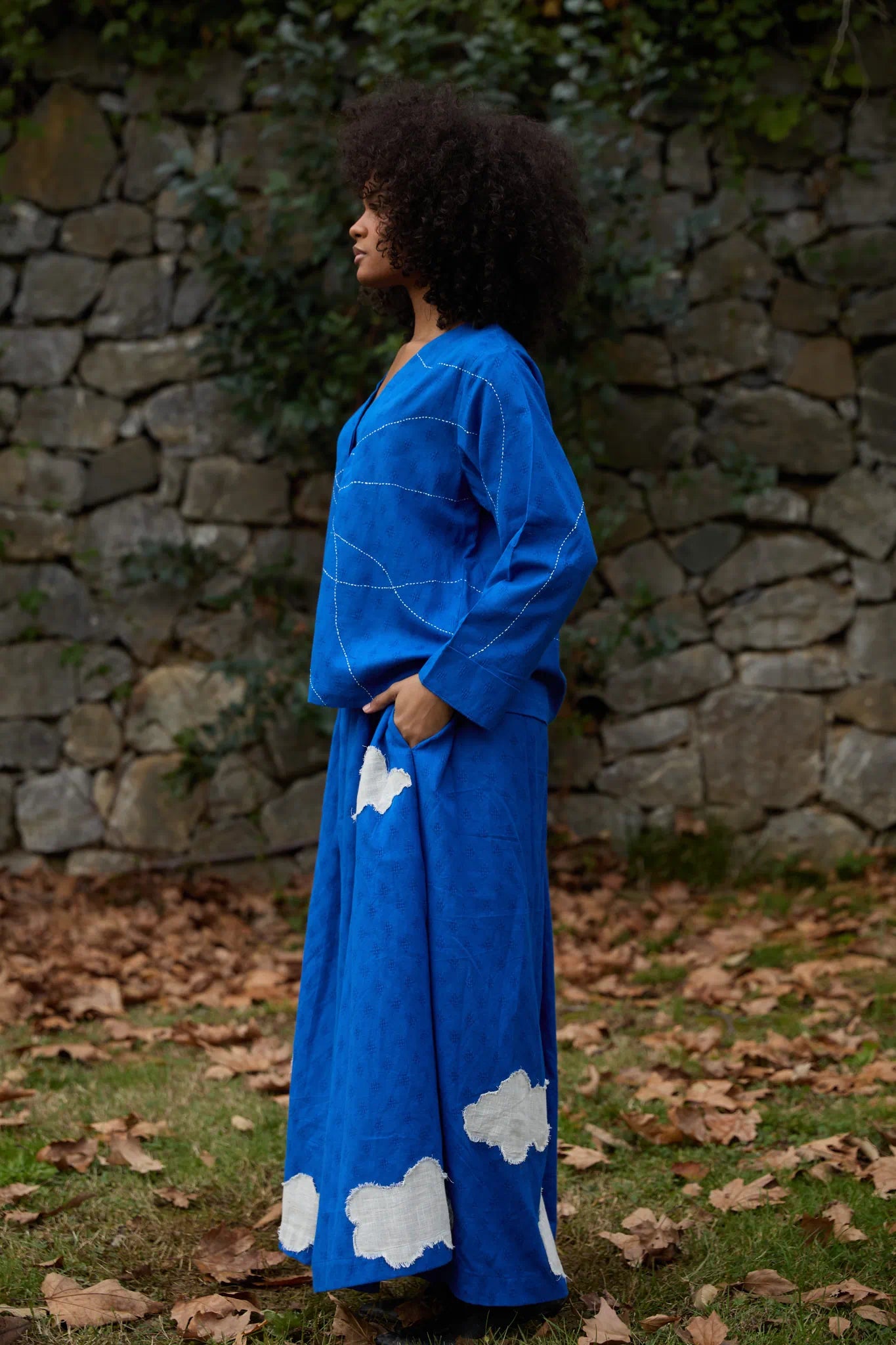 White Canvas Cloud Glimpse Set in blue handwoven dobby cotton with applique work and Kantha stitching, side view on model