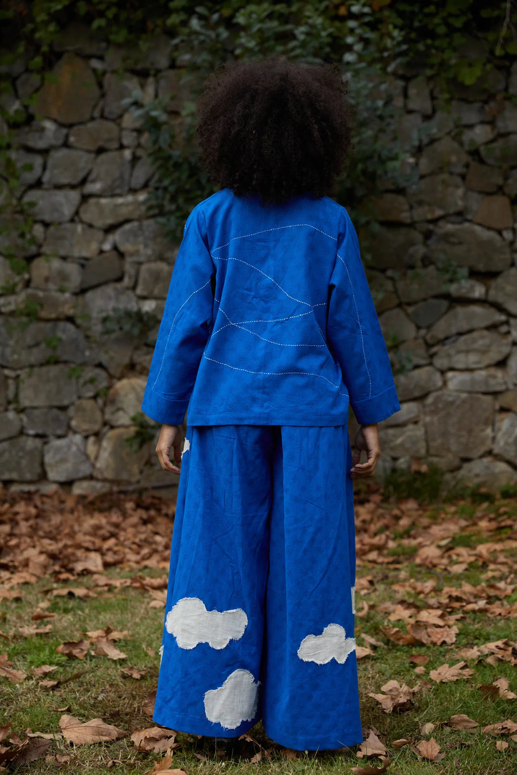 White Canvas Cloud Glimpse Set in blue handwoven dobby cotton with applique work and Kantha stitching, back view on model