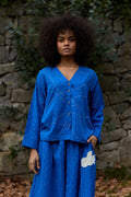 White Canvas Cloud Glimpse Top in blue handwoven dobby cotton with Kantha stitching, front view on model