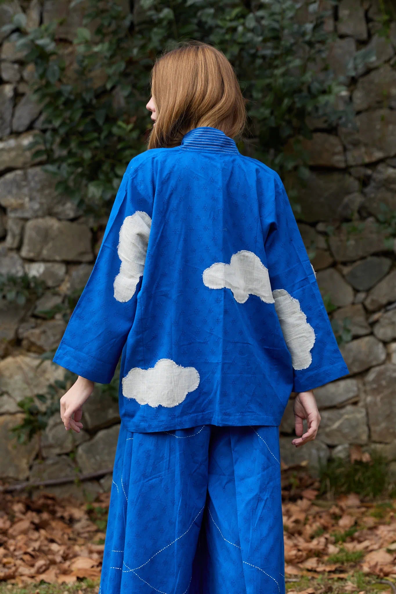 White Canvas Cloud Indore Jacket in blue handwoven dobby cotton with applique work, side view on model