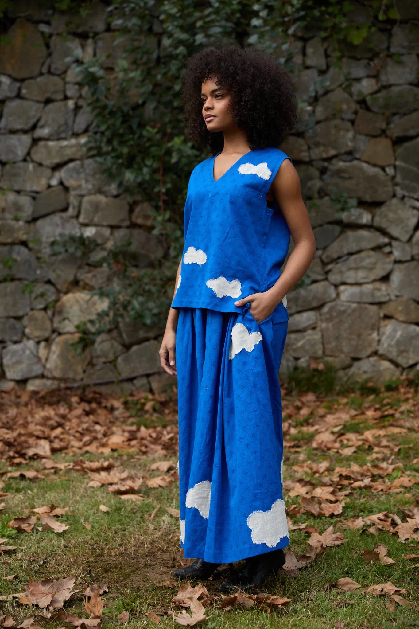 White Canvas Cloud Jerry Set in blue handwoven dobby cotton with applique work, angled view on model