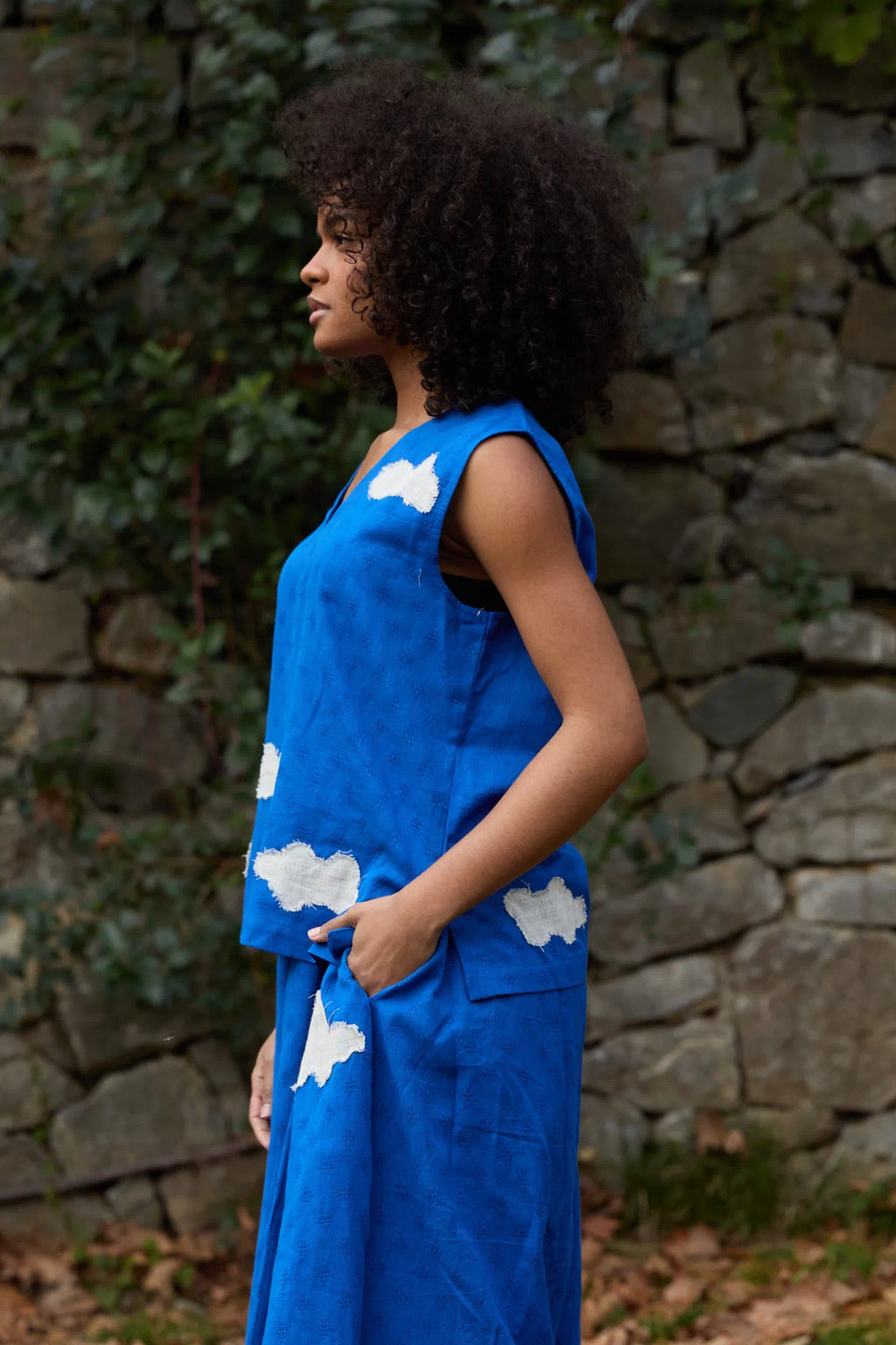 White Canvas Cloud Jerry Top in blue handwoven dobby cotton with applique work, side view on model