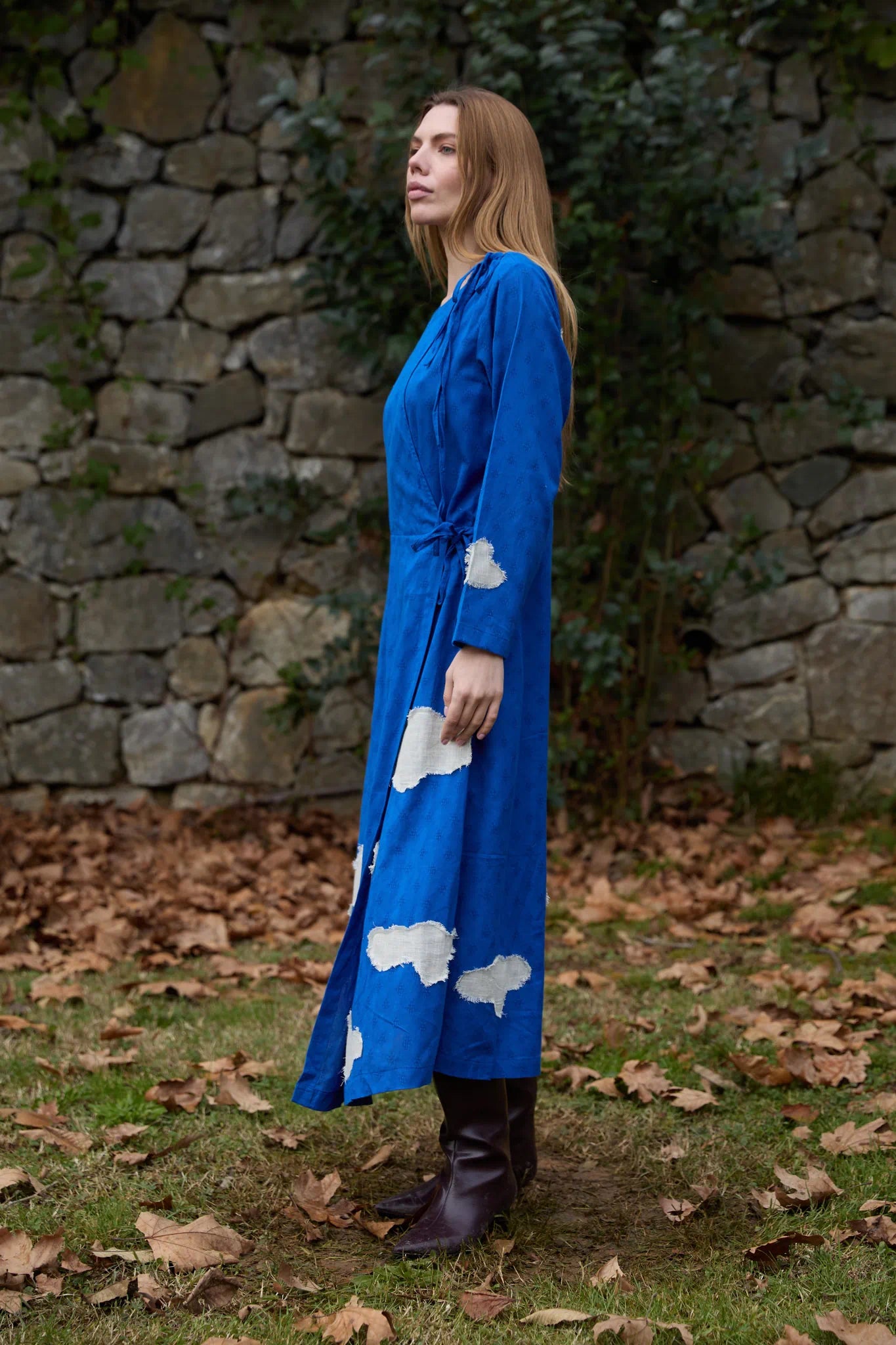 White Canvas Cloud Metis Dress in blue handwoven dobby cotton with applique work, side view on model