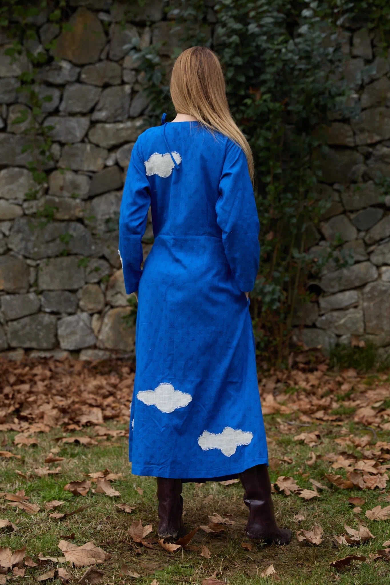 White Canvas Cloud Metis Dress in blue handwoven dobby cotton with applique work, detail view on model