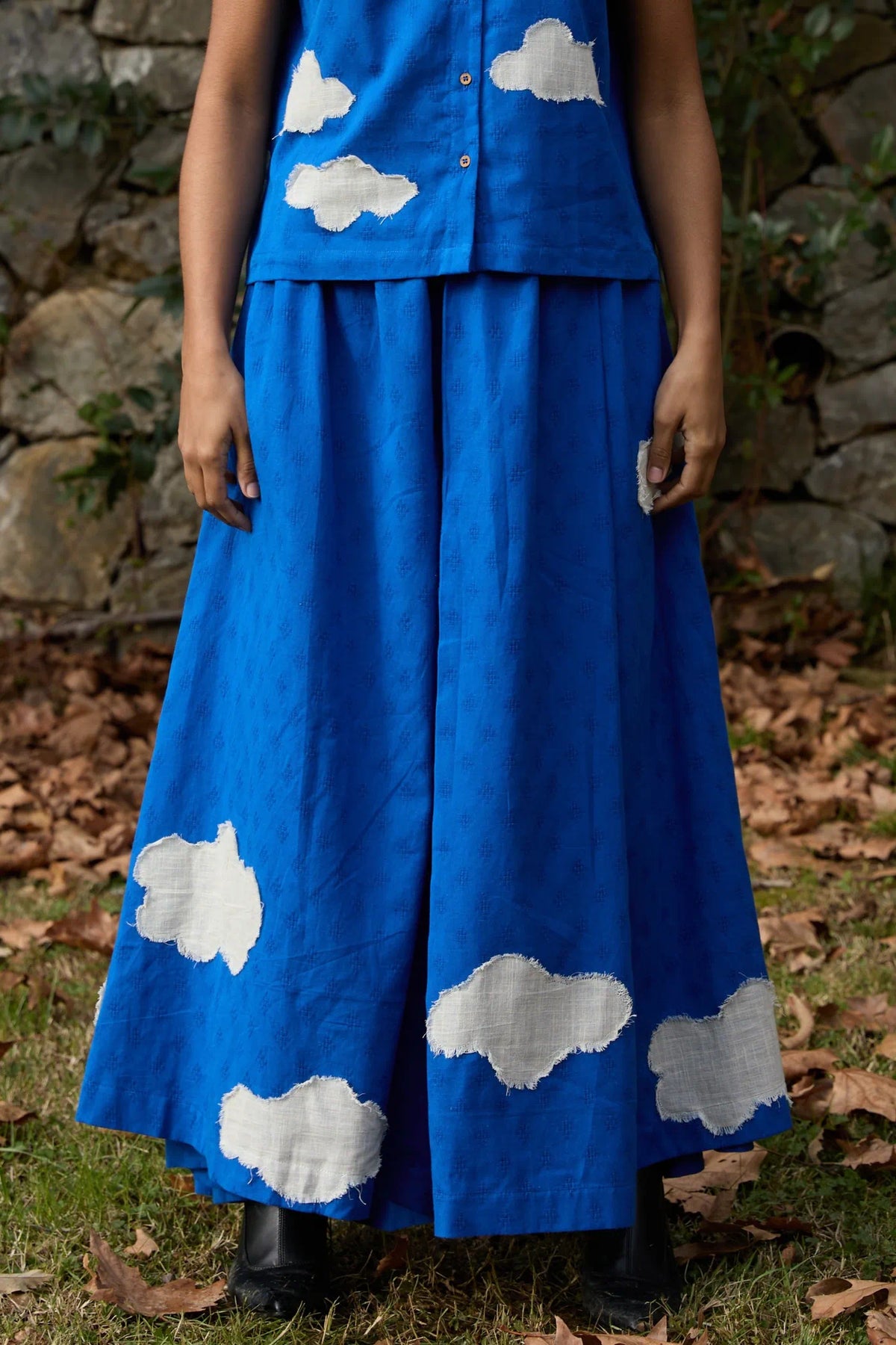 White Canvas Cloud Marti Pants in blue handwoven dobby cotton with applique work, front view on model