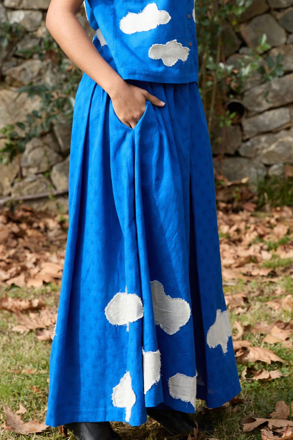White Canvas Cloud Marti Pants in blue handwoven dobby cotton with applique work, back view on model