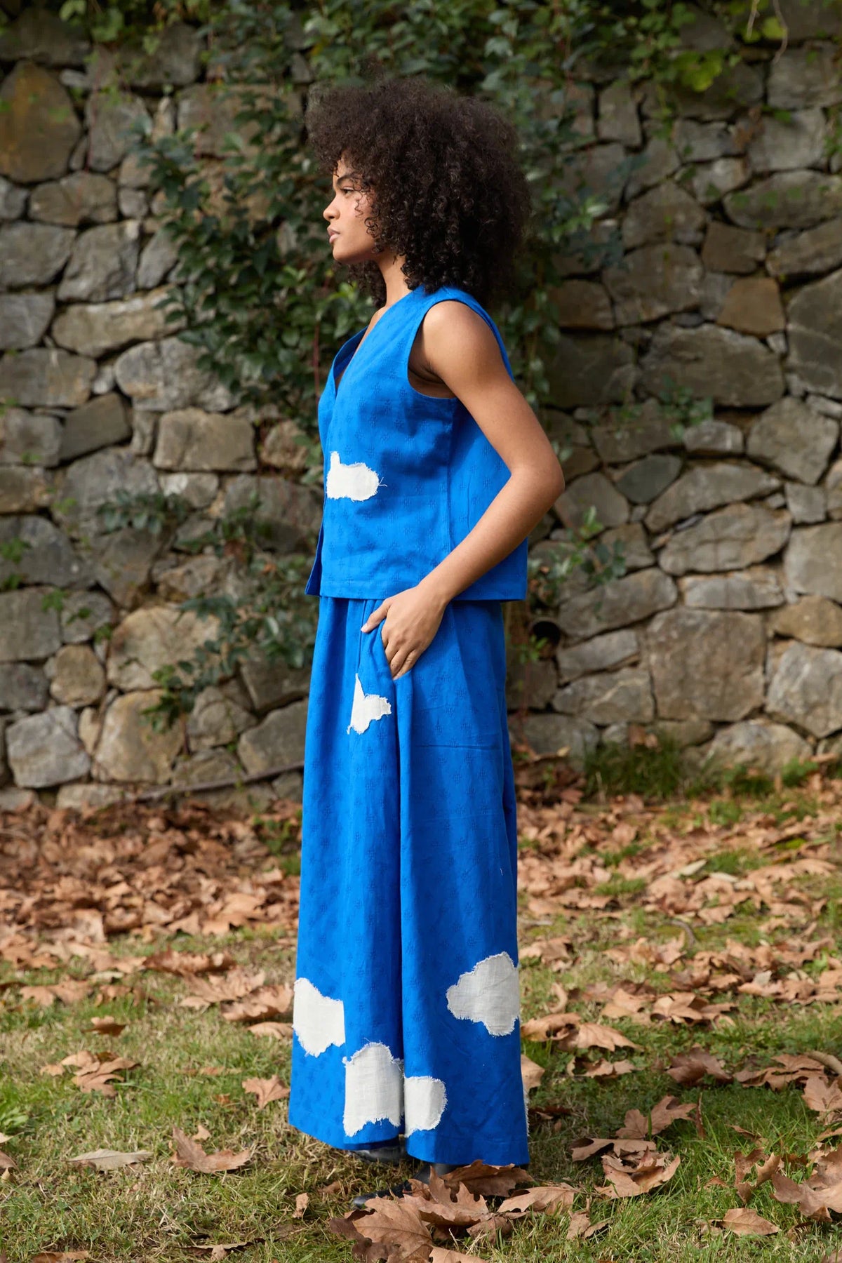 White Canvas Cloud Marti Set in blue handwoven dobby cotton with applique work, angled view on model
