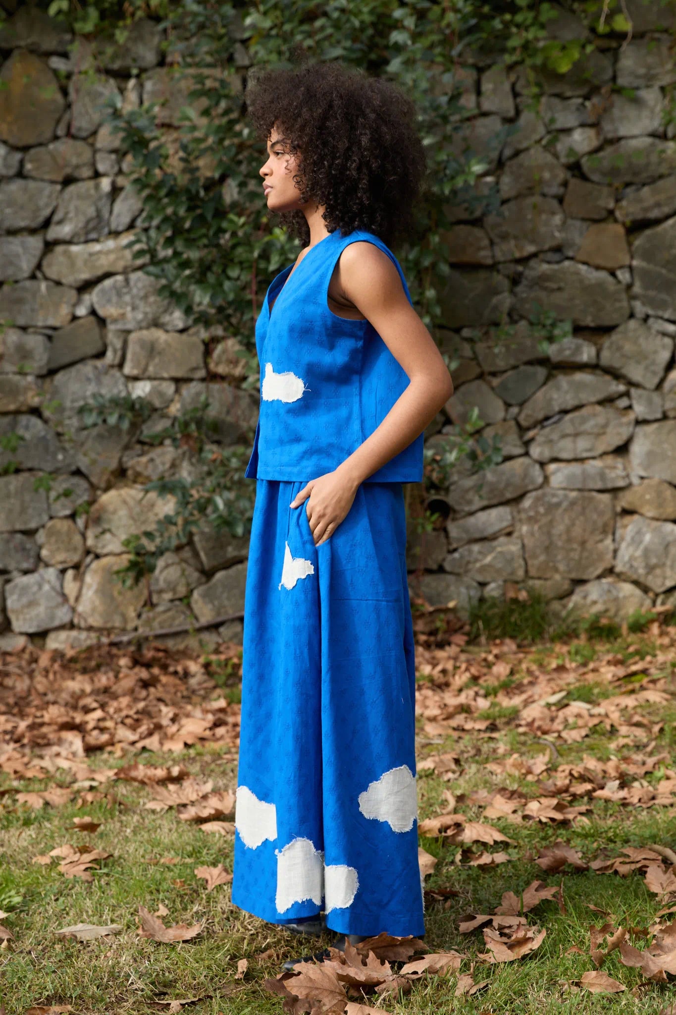 White Canvas Cloud Marti Set in blue handwoven dobby cotton with applique work, angled view on model