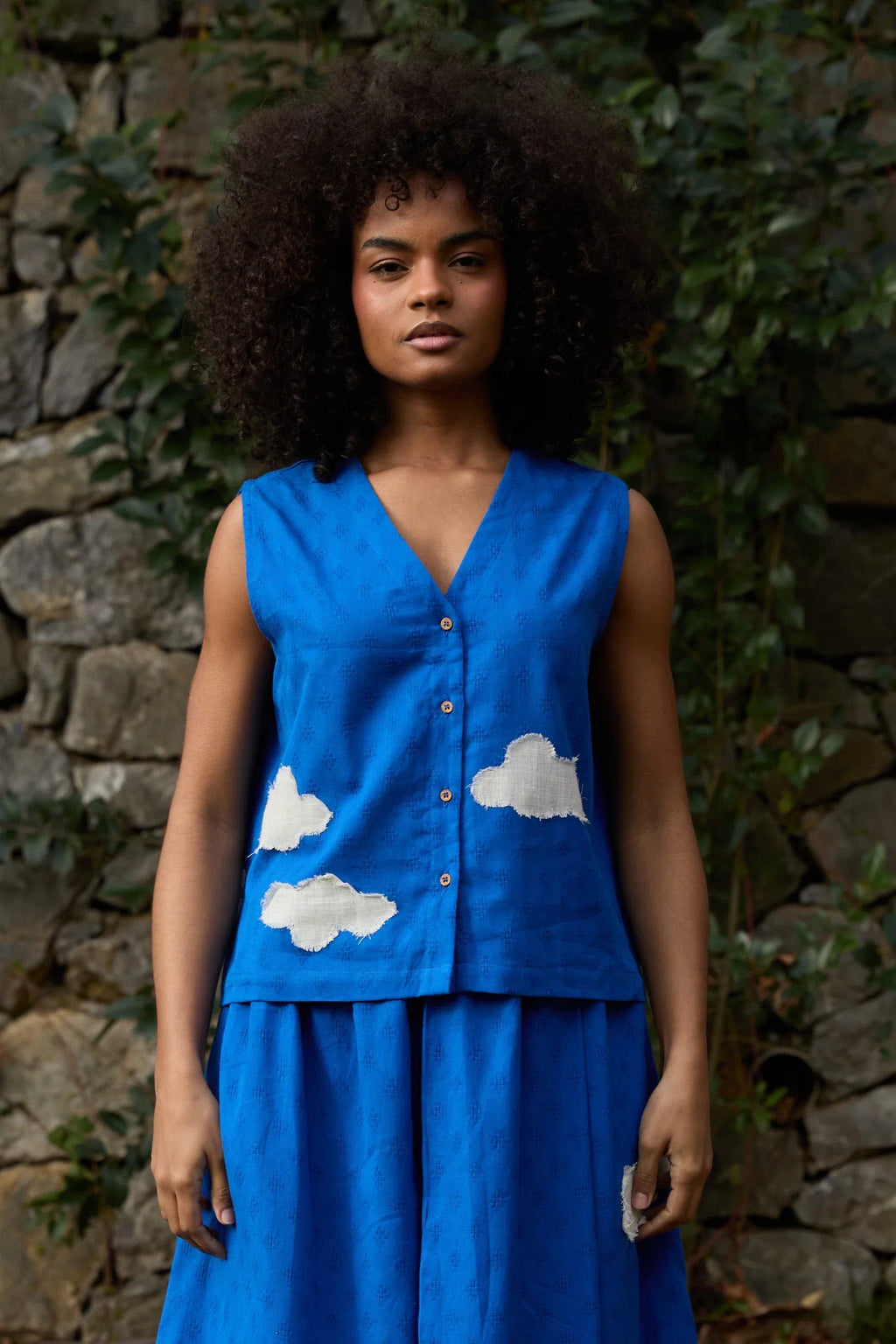 White Canvas Cloud Marti Vest in blue handwoven dobby cotton with applique work, front view on model