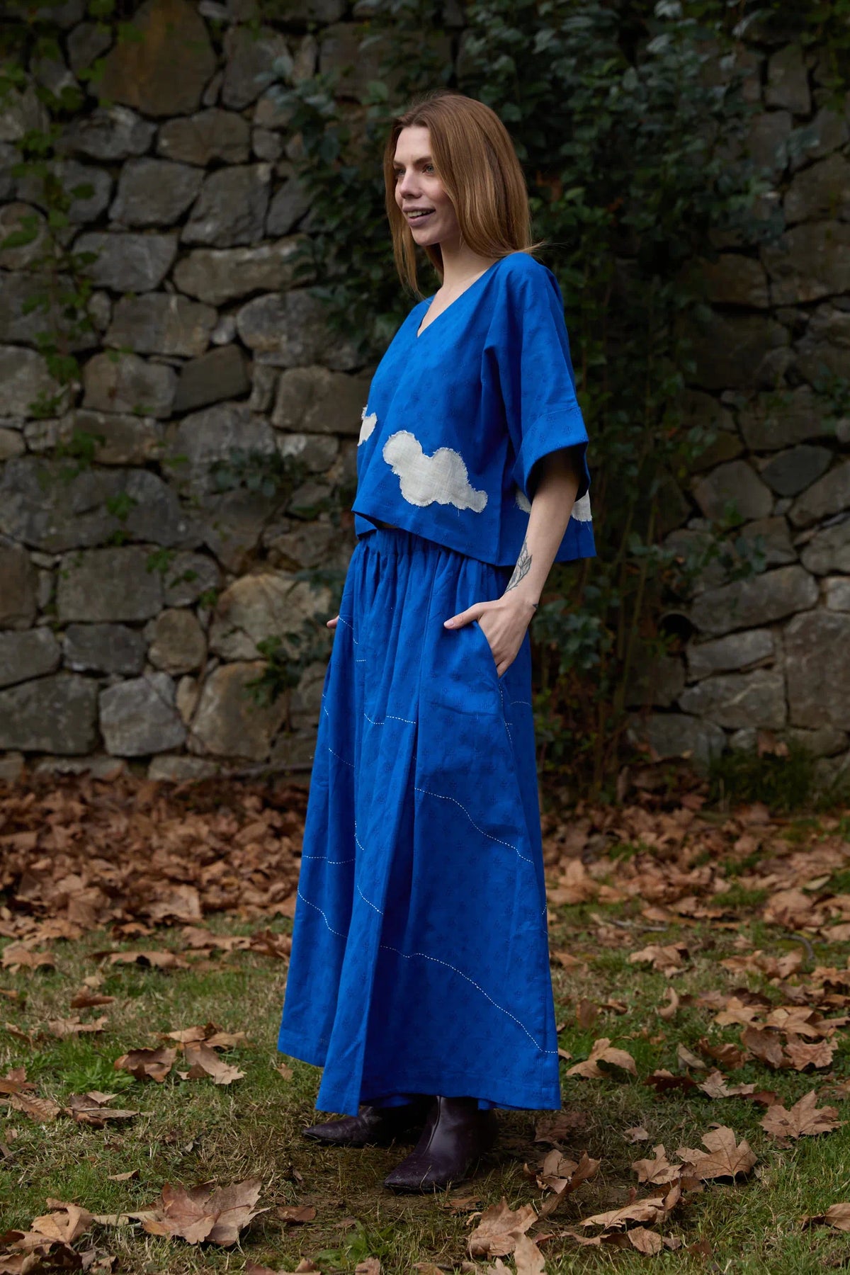 White Canvas Cloud Nikki Set in blue handwoven dobby cotton with applique work and Kantha stitching, angled view on model