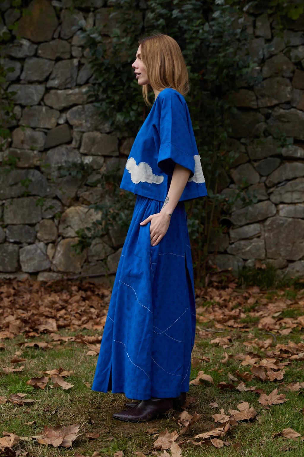 White Canvas Cloud Nikki Set in blue handwoven dobby cotton with applique work and Kantha stitching, side view on model