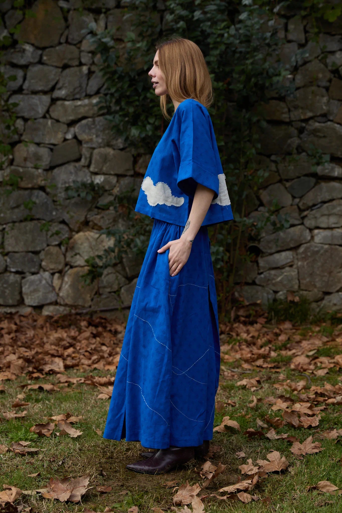 White Canvas Cloud Nikki Set in blue handwoven dobby cotton with applique work and Kantha stitching, side view on model