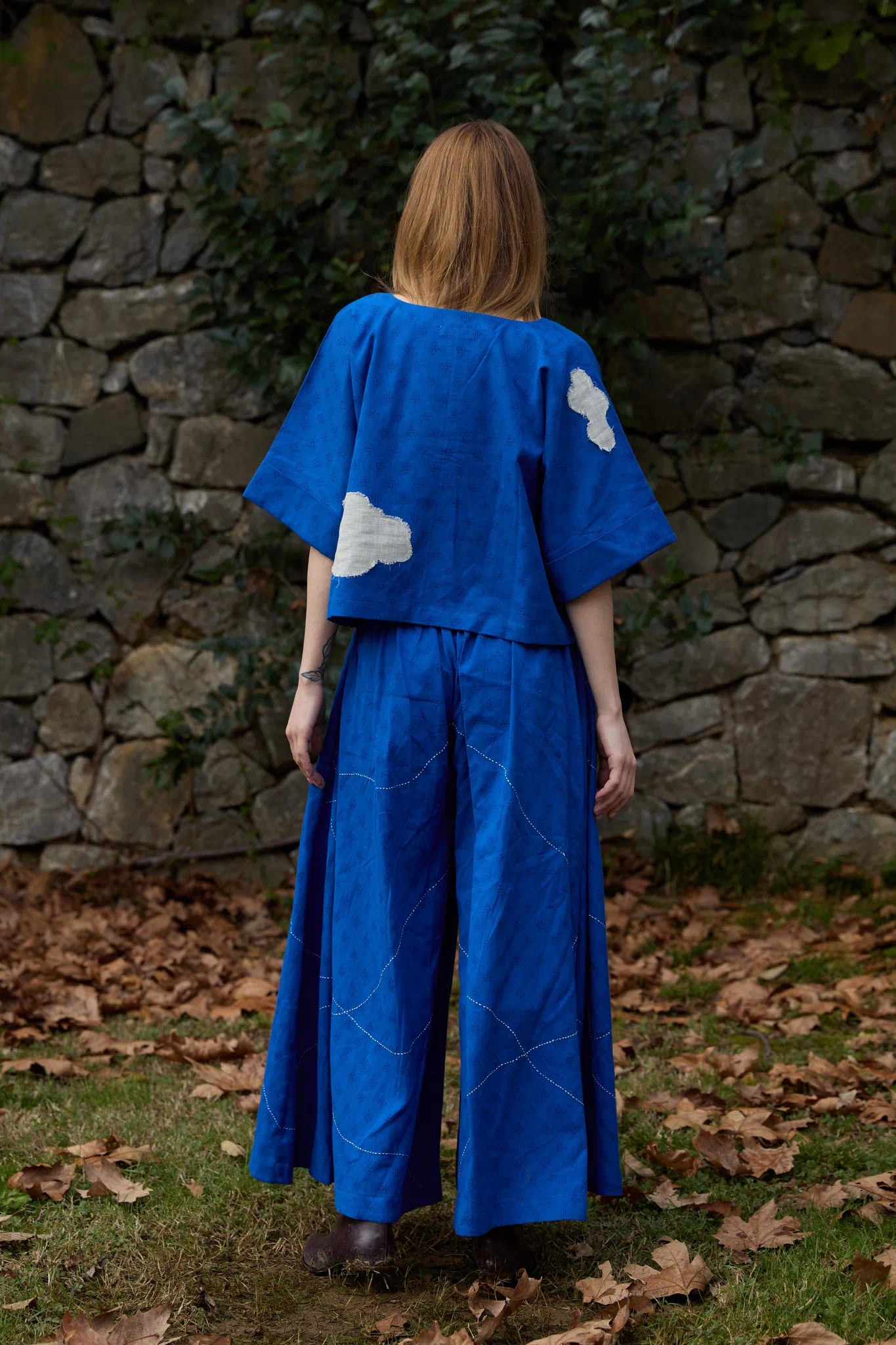 White Canvas Cloud Nikki Set in blue handwoven dobby cotton with applique work and Kantha stitching, back view on model