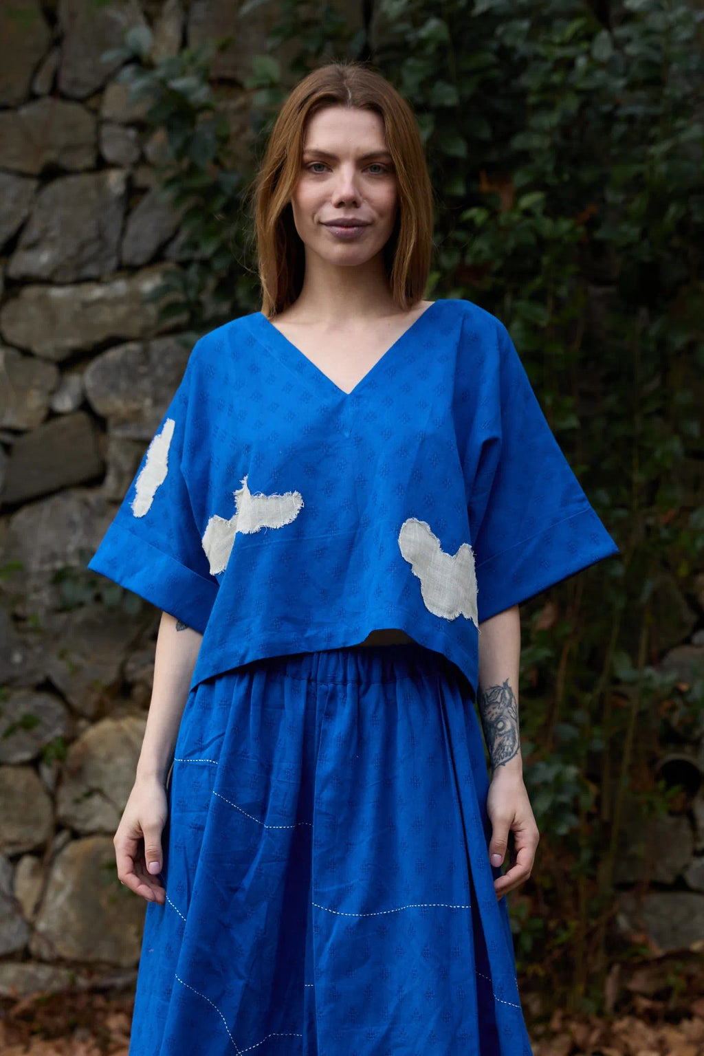 White Canvas Cloud Nikki Top in blue handwoven dobby cotton with applique work, front view on model