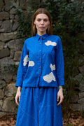 White Canvas Cloud Only Shirt in blue handwoven dobby cotton with applique work and Kantha stitching, front view on model