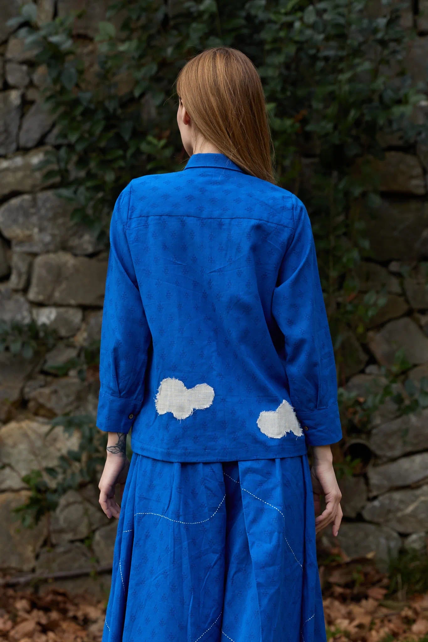 White Canvas Cloud Only Shirt in blue handwoven dobby cotton with applique work and Kantha stitching, back view on model