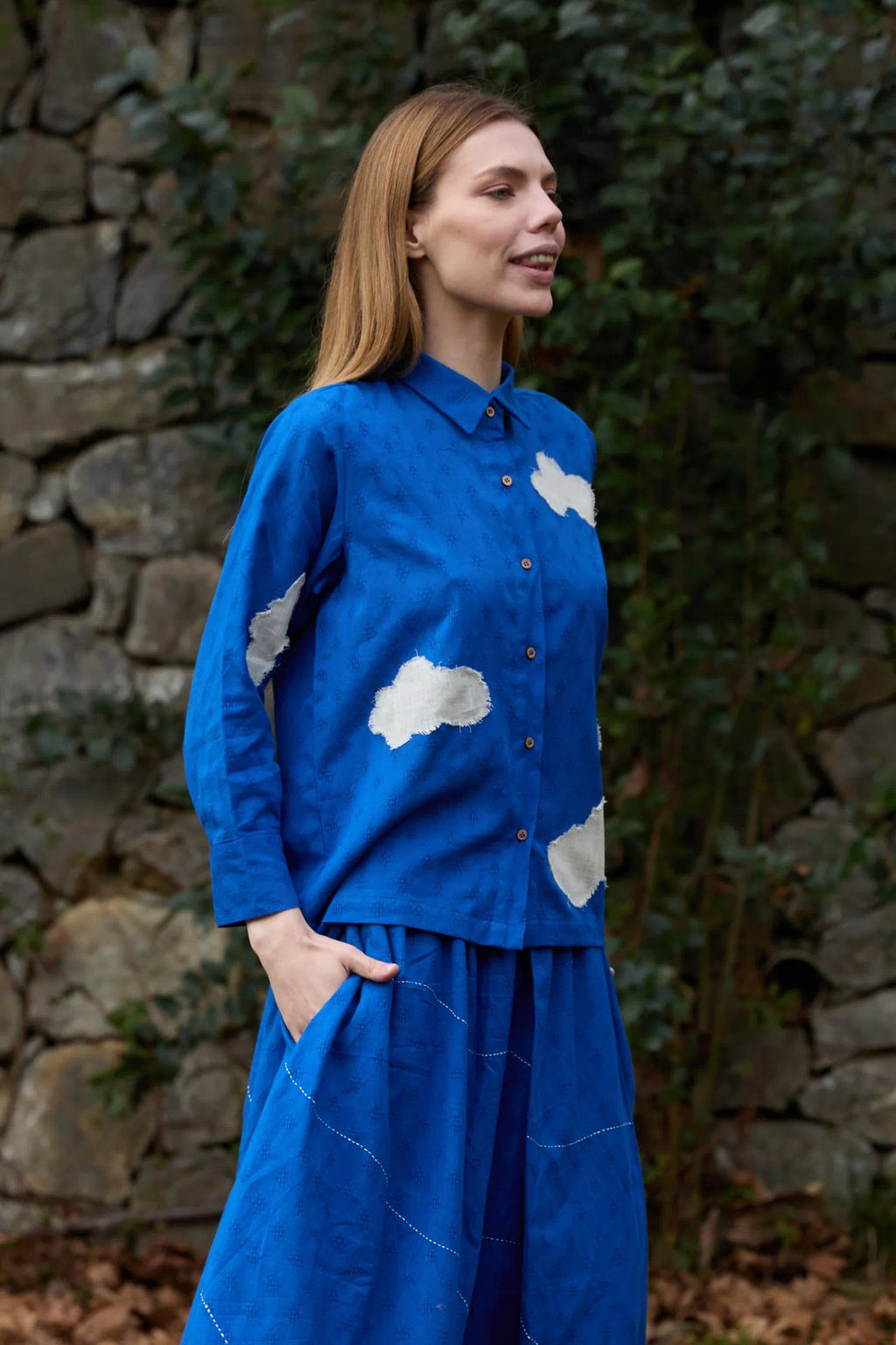 White Canvas Cloud Only Shirt in blue handwoven dobby cotton with applique work and Kantha stitching, detail view on model