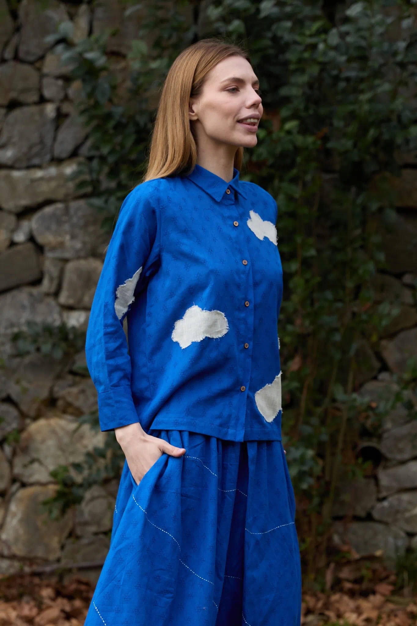 White Canvas Cloud Only Shirt in blue handwoven dobby cotton with applique work and Kantha stitching, detail view on model
