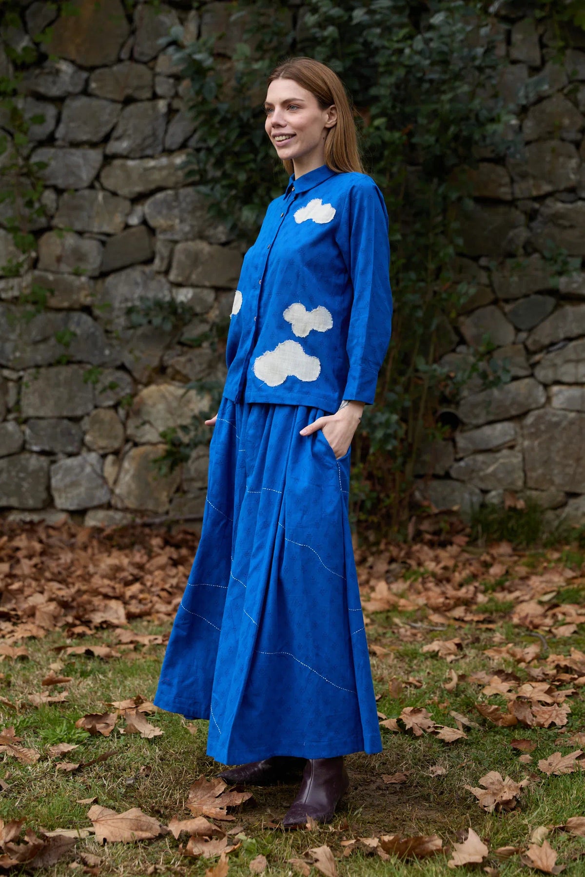 White Canvas Cloud Only Set in blue handwoven dobby cotton with applique work, angled view on model