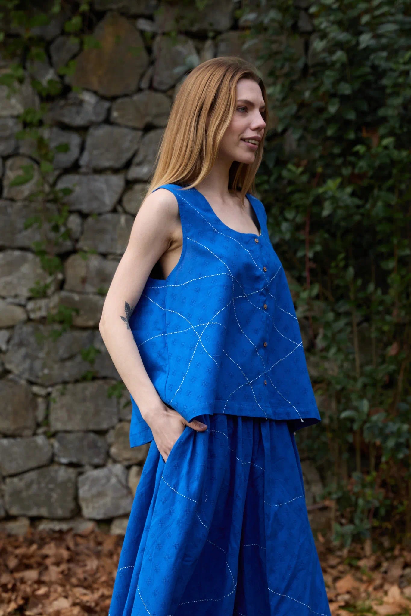White Canvas Cloud Surreal Top in blue handwoven dobby cotton with Kantha stitching, side view on model
