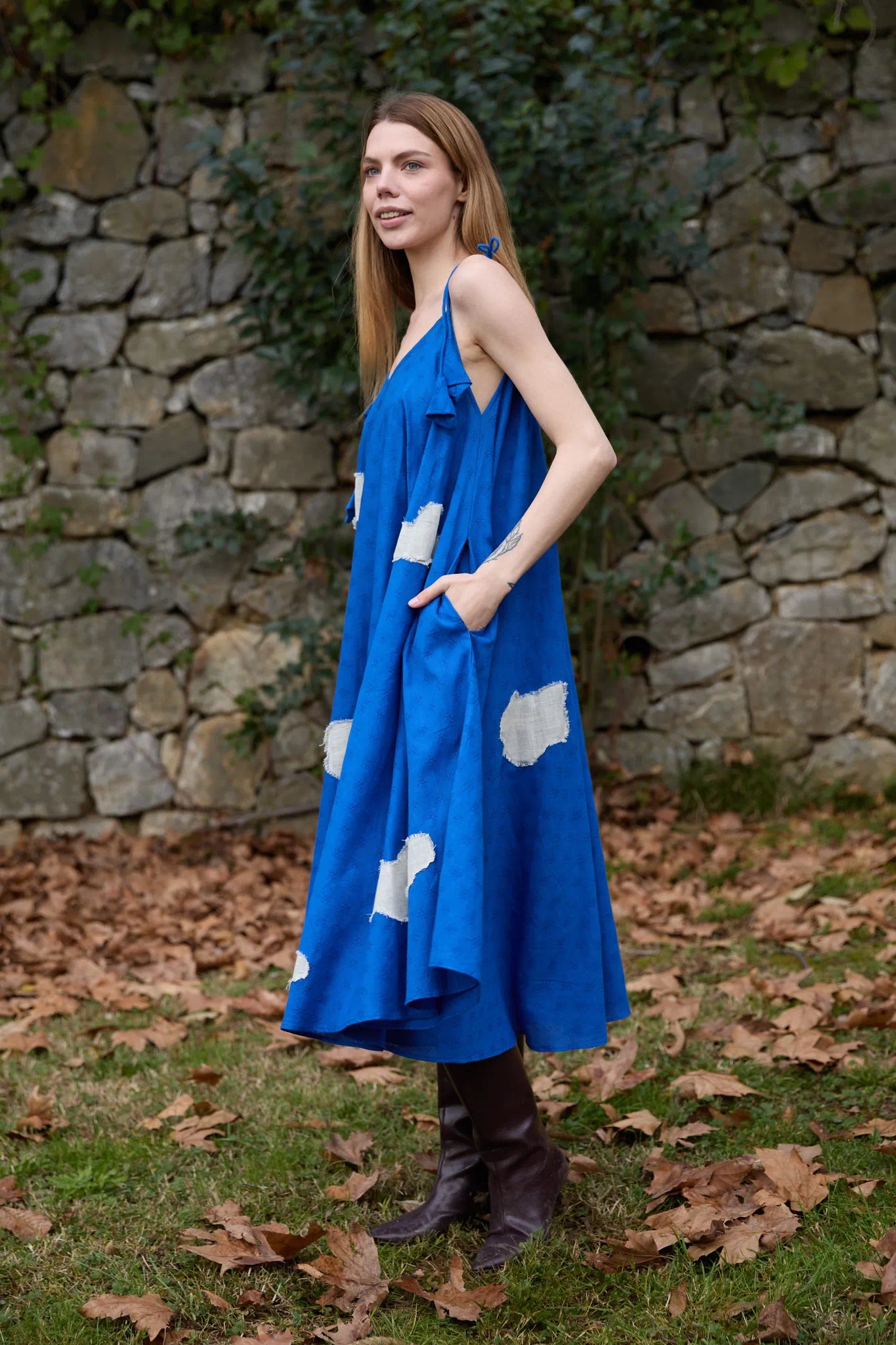 White Canvas Cloud Whirl Dress in blue handwoven dobby cotton with applique work, angled view on model