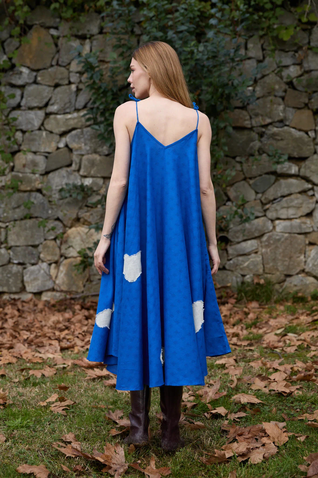 White Canvas Cloud Whirl Dress in blue handwoven dobby cotton with applique work, side view on model