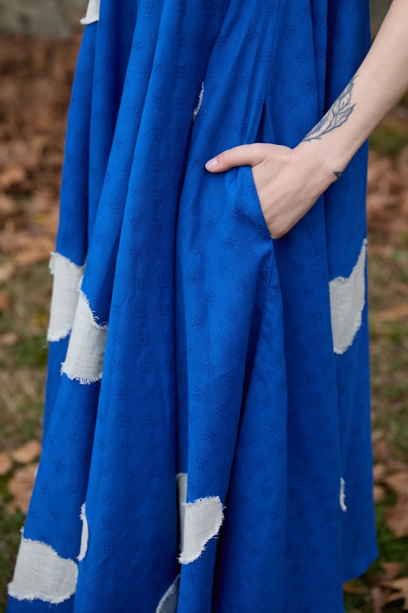 White Canvas Cloud Whirl Dress in blue handwoven dobby cotton with applique work, detail view on model
