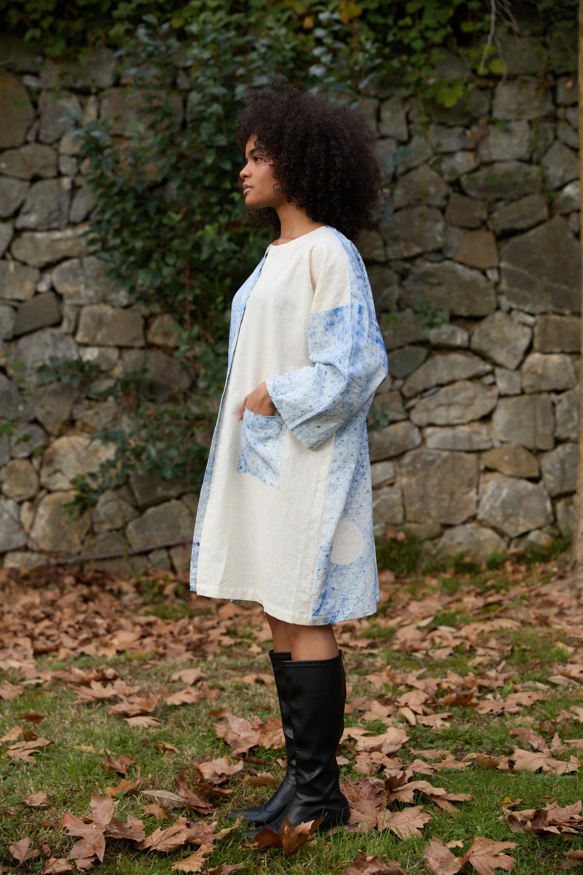 White Canvas Blue Marti Dress in blue handwoven dobby cotton (100%) with handwoven texture, angled view on model