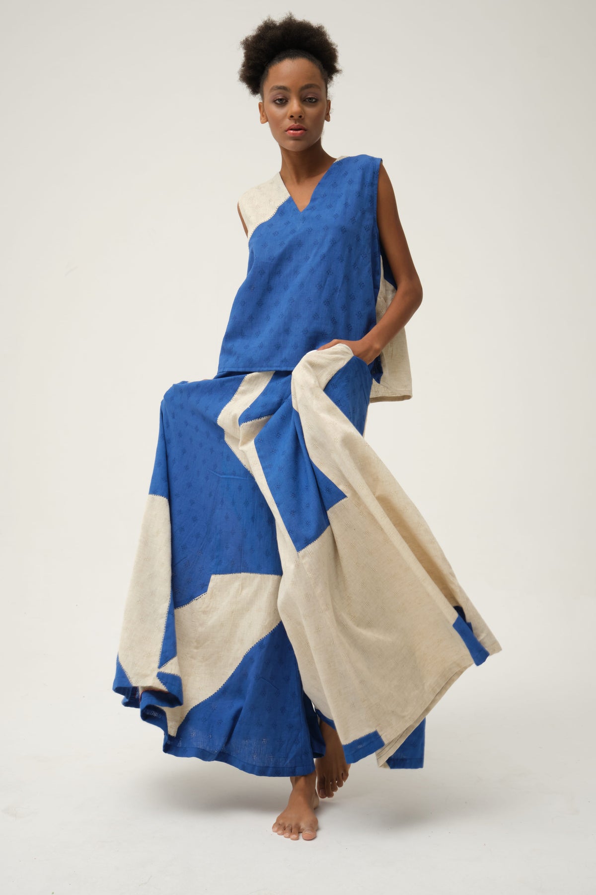 White Canvas Blue Bunny Set in blue handwoven dobby cotton with handwoven texture, angled view on model