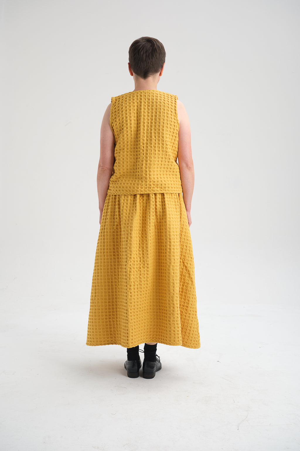 Handmade yellow dress in Istanbul – ethically crafted from breathable cotton fabric. A timeless, sustainable fashion piece with artisanal stitching, perfect for travelers and fashion lovers visiting Turkey